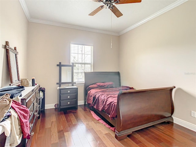 bedroom with crown molding, dark hardwood / wood-style floors, and ceiling fan