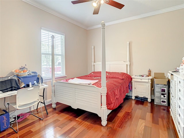 bedroom featuring ceiling fan, dark hardwood / wood-style floors, and crown molding