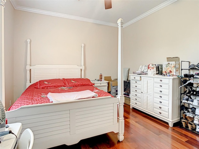 bedroom with ceiling fan, hardwood / wood-style floors, and ornamental molding