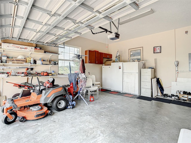 garage featuring a garage door opener and white refrigerator