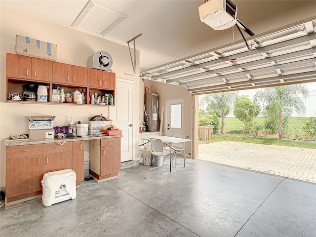 garage with a garage door opener and water heater