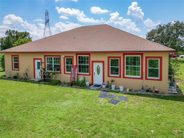 single story home featuring a front yard