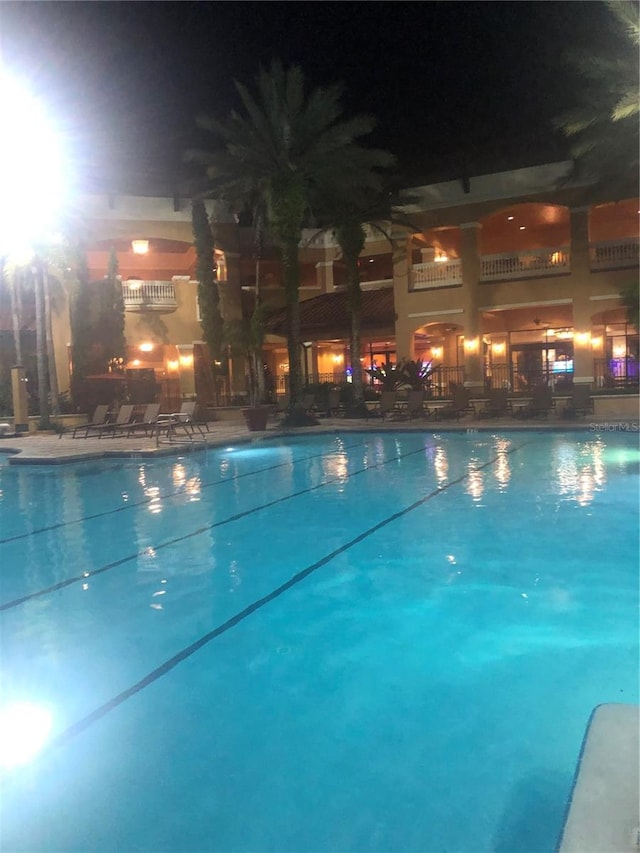 view of pool at night