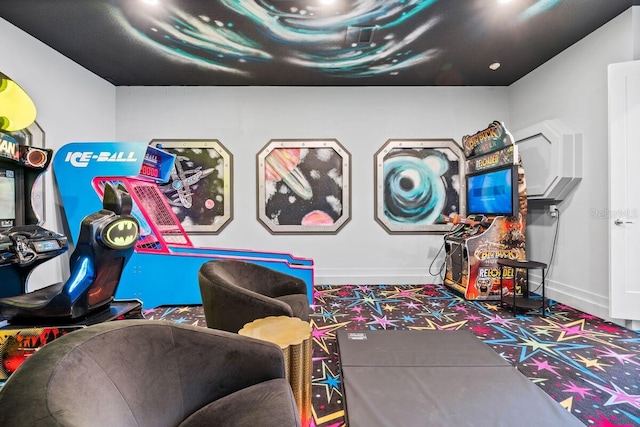 game room featuring dark colored carpet