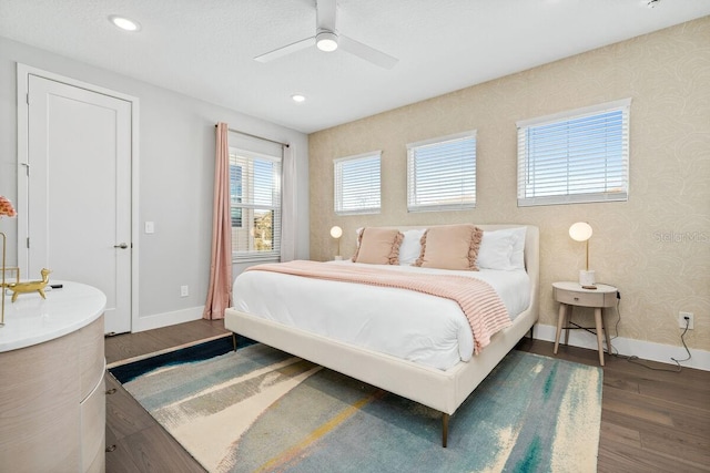 bedroom featuring ceiling fan and dark wood-type flooring