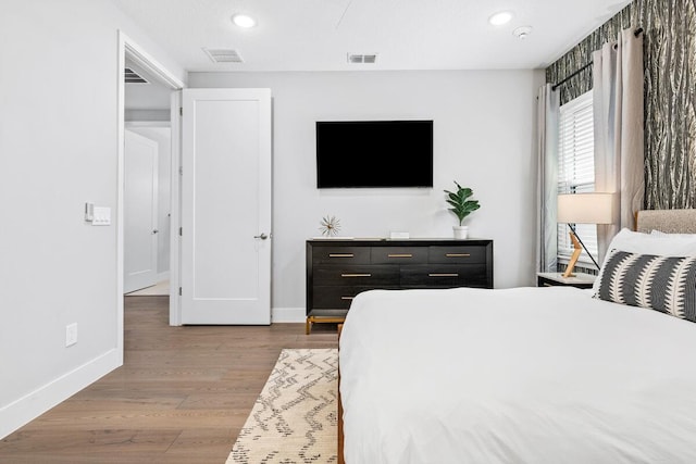 bedroom with light hardwood / wood-style floors