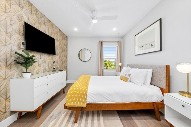 bedroom featuring ceiling fan and light wood-type flooring