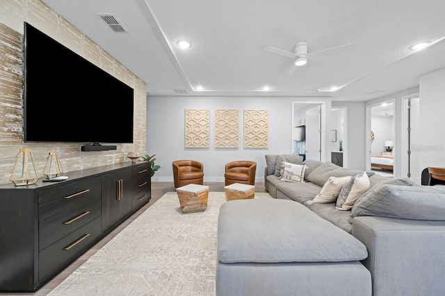 living room featuring ceiling fan