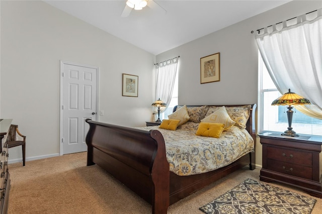 carpeted bedroom with ceiling fan and lofted ceiling