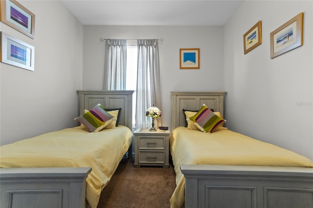 bedroom with dark colored carpet