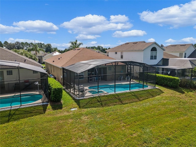 view of swimming pool featuring a lawn and a patio