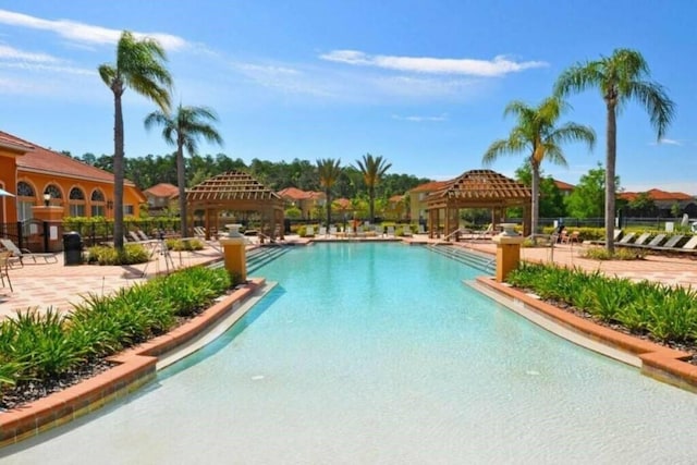 view of swimming pool featuring a gazebo