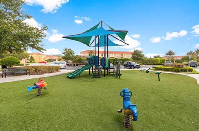 view of playground featuring a lawn