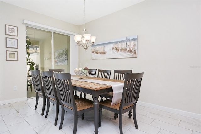 tiled dining space with a notable chandelier