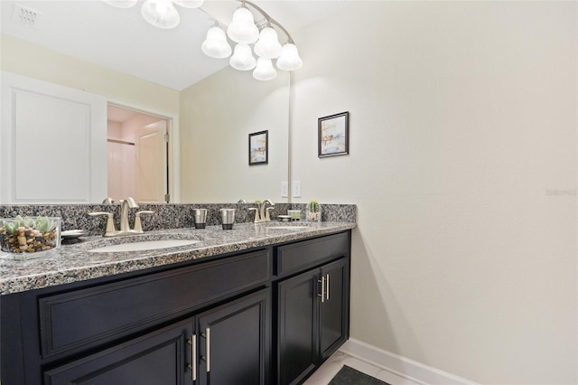 bathroom featuring double sink vanity and tile flooring