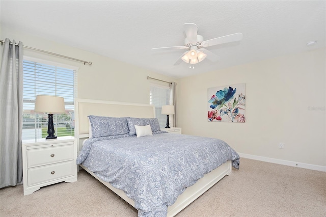 bedroom with light colored carpet and ceiling fan