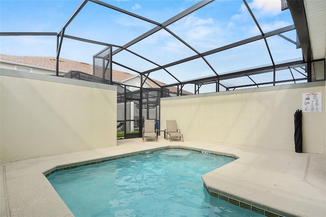 view of pool with a lanai and a patio