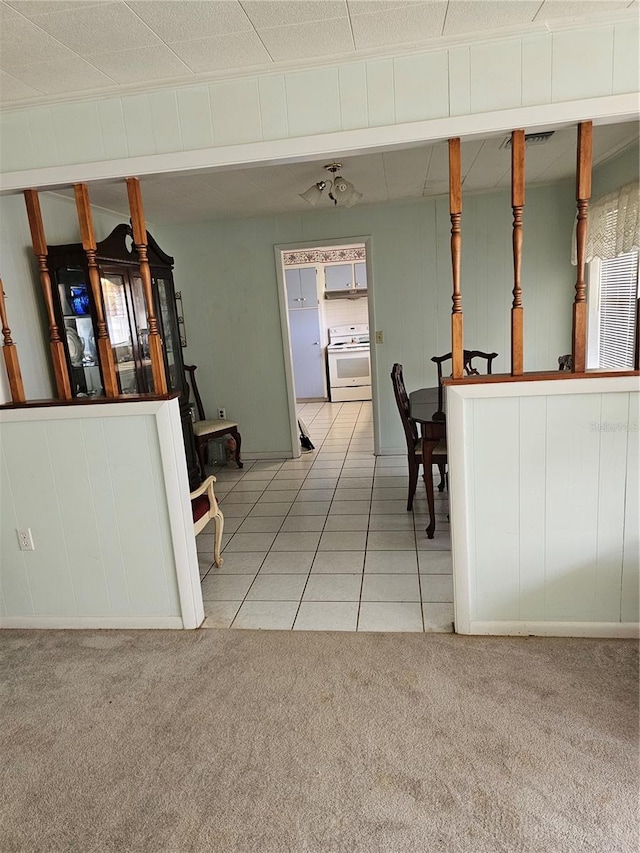 interior space featuring light colored carpet