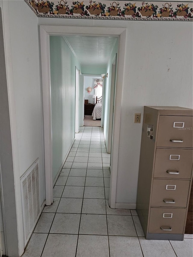 hallway featuring light tile flooring