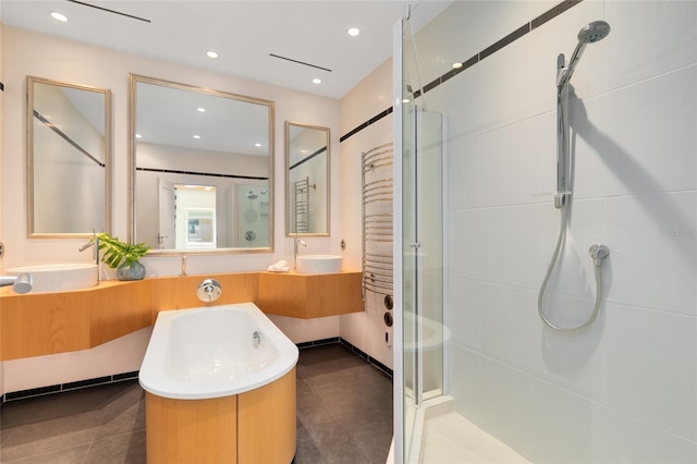 bathroom featuring tile patterned flooring, vanity, and an enclosed shower