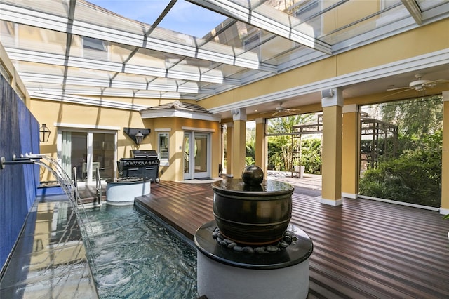 exterior space with a swimming pool side deck, ceiling fan, french doors, and pool water feature