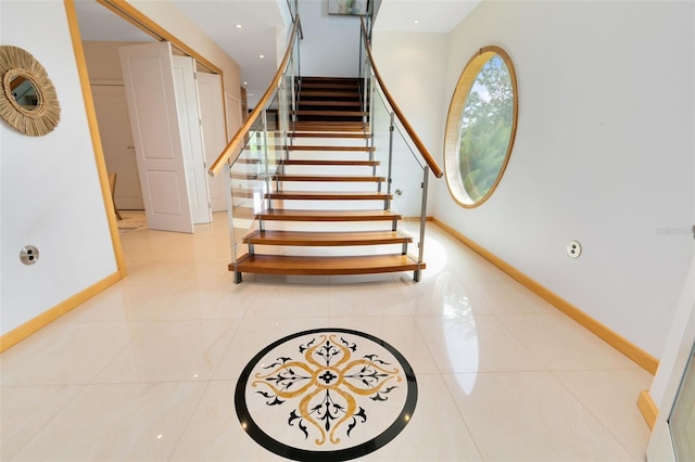 staircase with tile patterned flooring