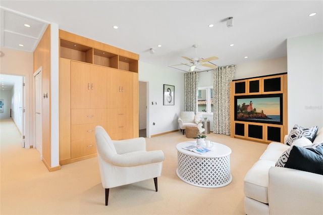 living room with ceiling fan and light colored carpet