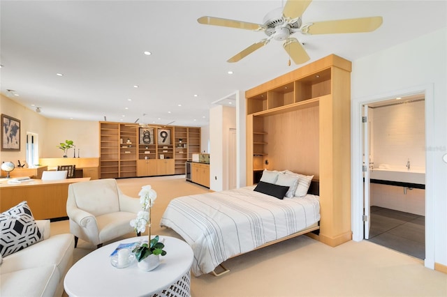 bedroom featuring ceiling fan, light carpet, and a closet