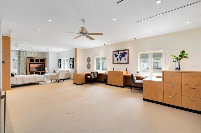 carpeted bedroom with ceiling fan