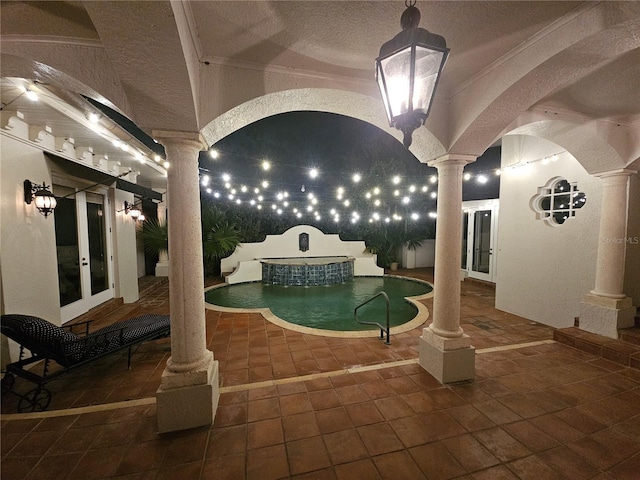 view of pool featuring french doors and a patio