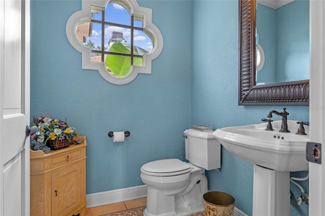 bathroom with tile patterned flooring and toilet