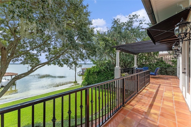 balcony featuring a water view