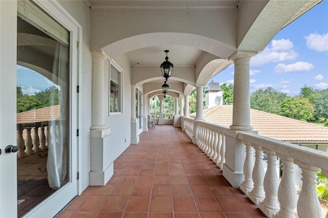 view of patio featuring a balcony