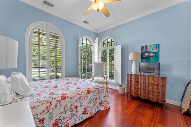 bedroom with ceiling fan, ornamental molding, and dark hardwood / wood-style floors