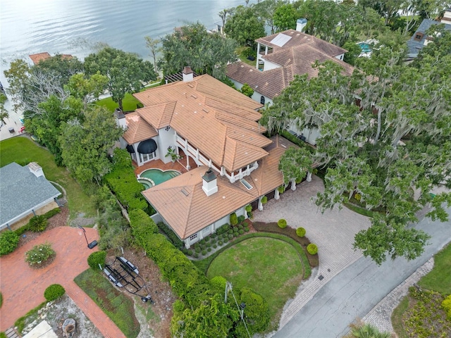 birds eye view of property with a water view