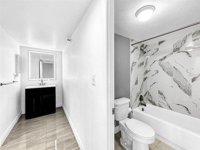 full bathroom featuring baseboards, toilet, bathtub / shower combination, and vanity