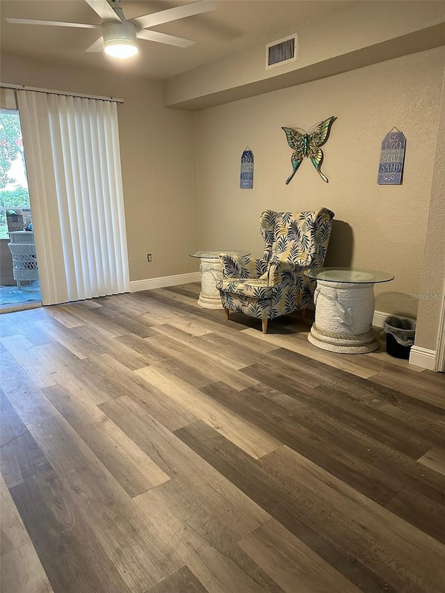 unfurnished room with ceiling fan and wood-type flooring