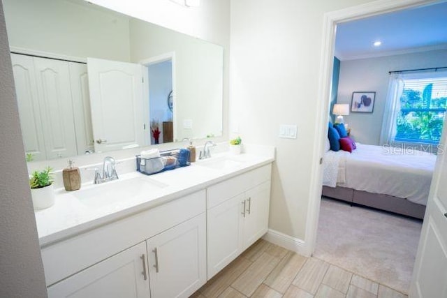 bathroom with vanity and ornamental molding