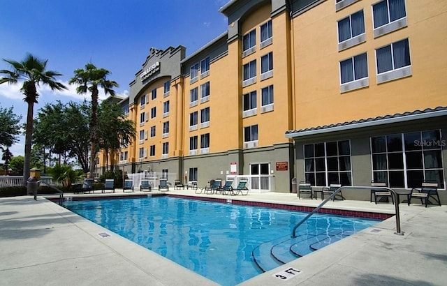 view of swimming pool with a patio