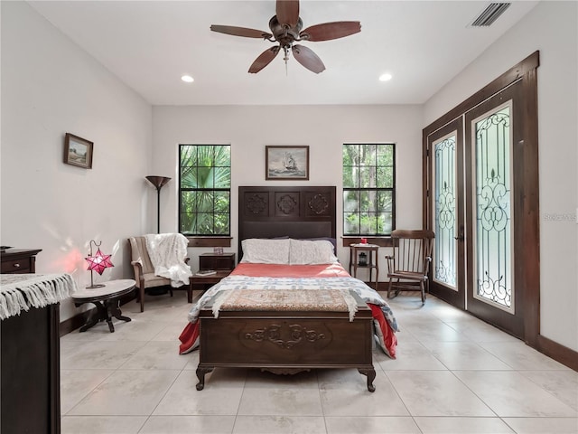 tiled bedroom with ceiling fan