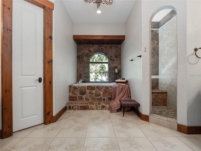 bathroom featuring tile patterned flooring and independent shower and bath