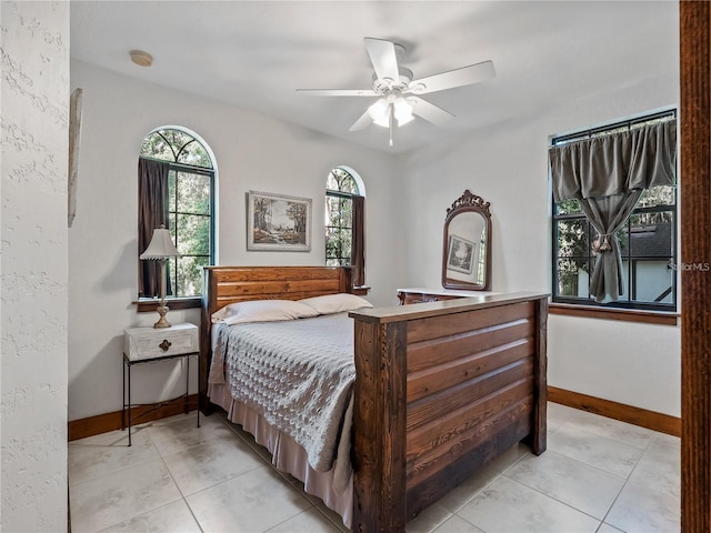 bedroom featuring ceiling fan and light tile patterned floors