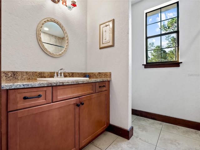 bathroom featuring tile patterned floors and vanity