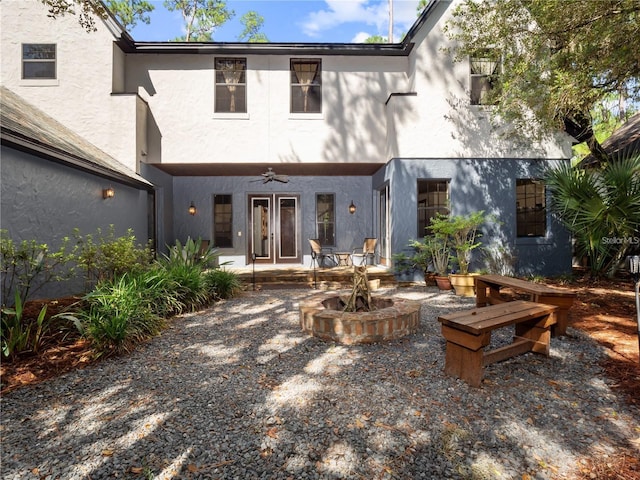 rear view of house featuring ceiling fan, a patio area, and french doors