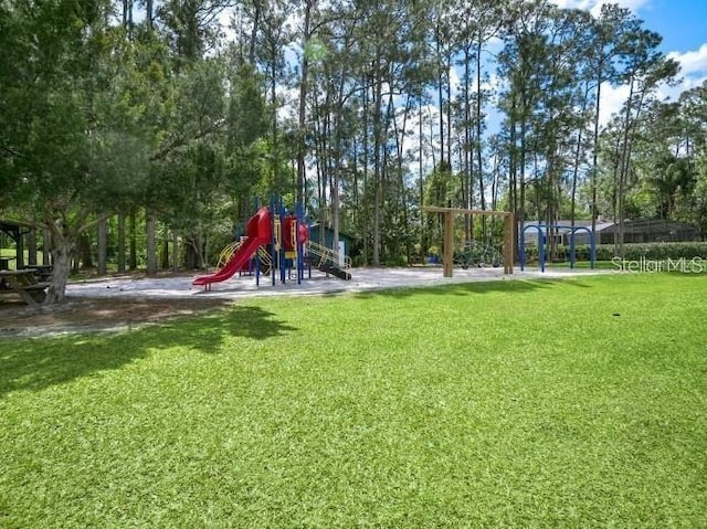 view of play area featuring a lawn