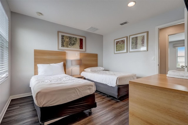 bedroom featuring dark wood-type flooring