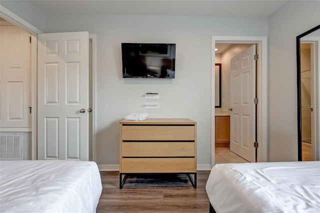 bedroom with light hardwood / wood-style floors