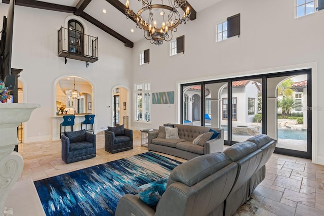 tiled living room featuring an inviting chandelier, beam ceiling, and high vaulted ceiling