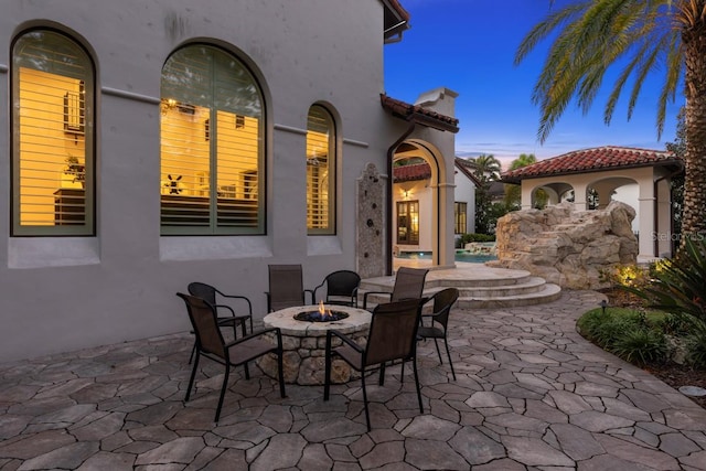 view of patio terrace at dusk