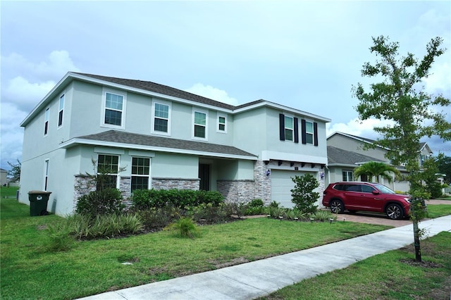 view of front of house featuring a front yard and a garage